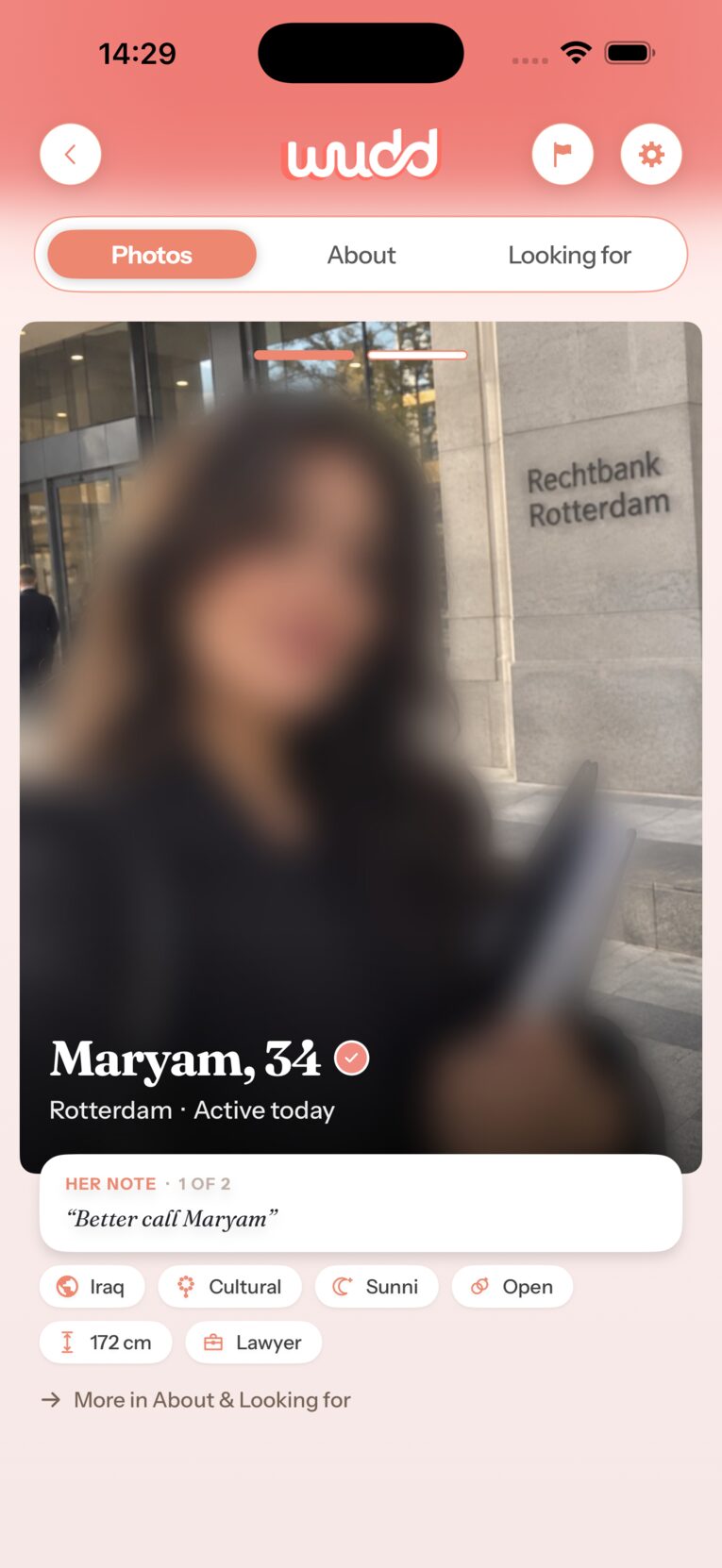 Wudd app — a member profile with verification badge; her photo stays blurred until you both say yes